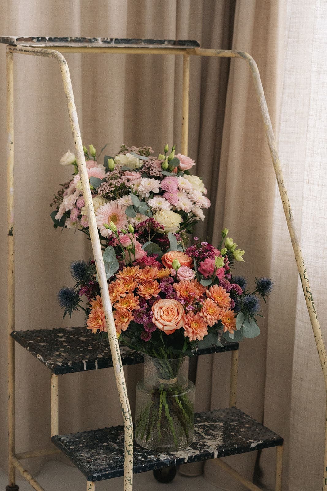 Bouquets arranged on a metal stand