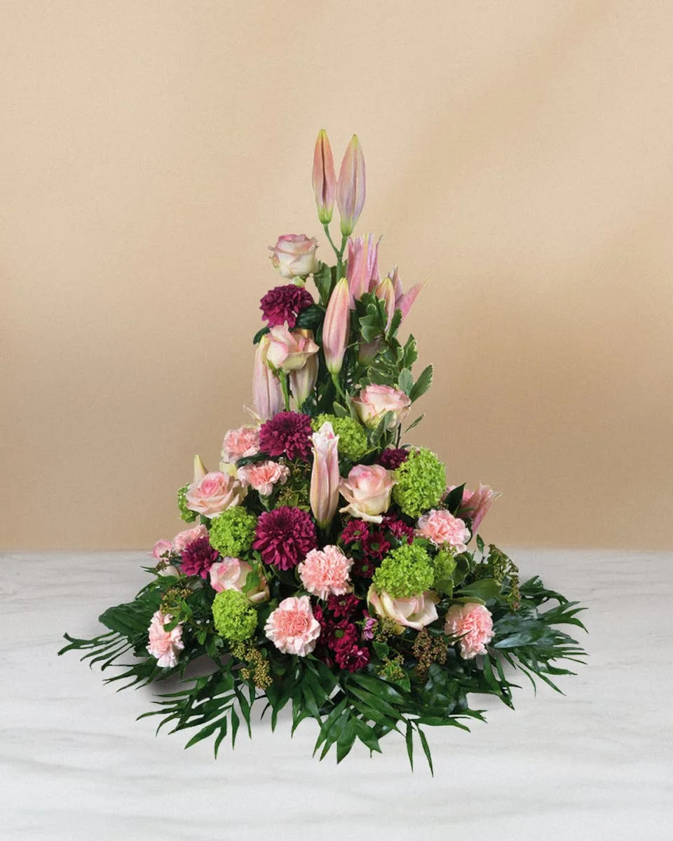 Trauerarrangement aus rosa und weissen Blumen